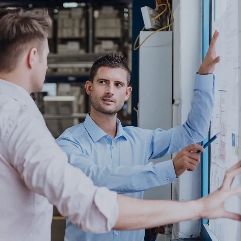 Executives designing the production plan for their company. Executives designing the production plan for their company.